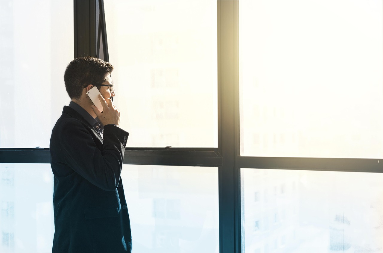 Man, cell phone, tuxedo — A Website Design Agency That Brings Your Vision to Life
