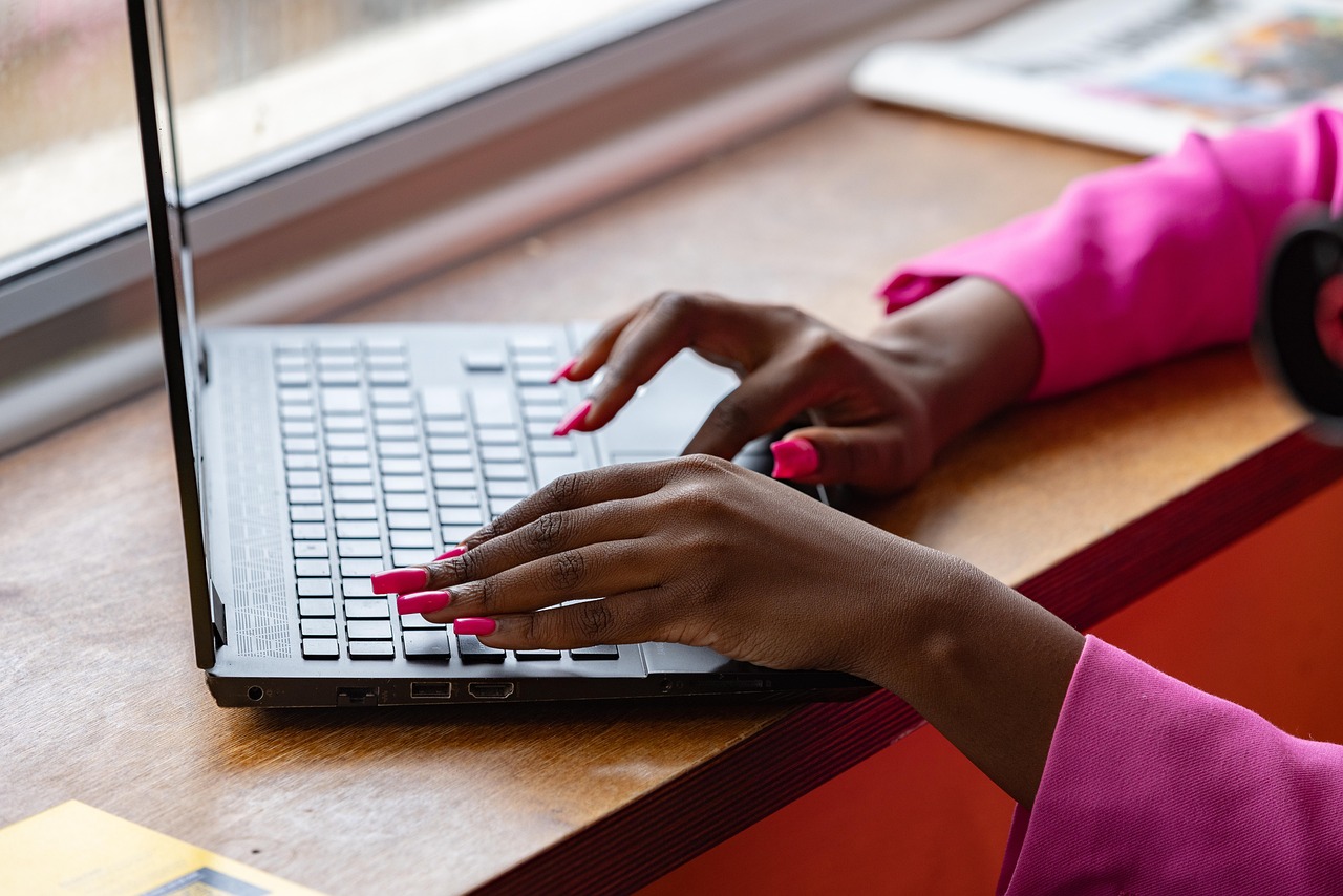 Laptop, typing, working — How Can You Choose the Best and Top Low Code Development Tools?